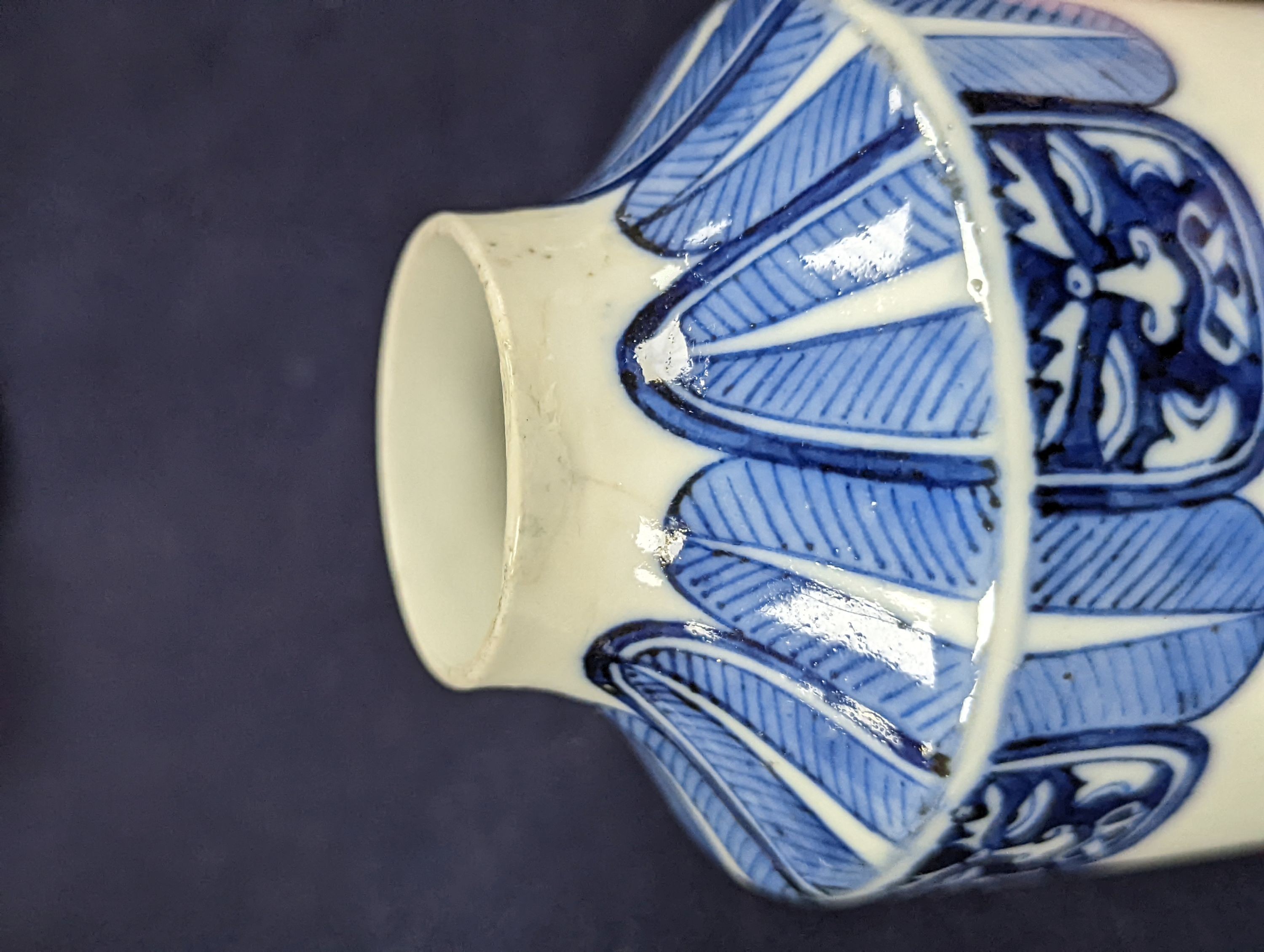 A Japanese blue and white vase, two similar dishes and a tea bowl and saucer